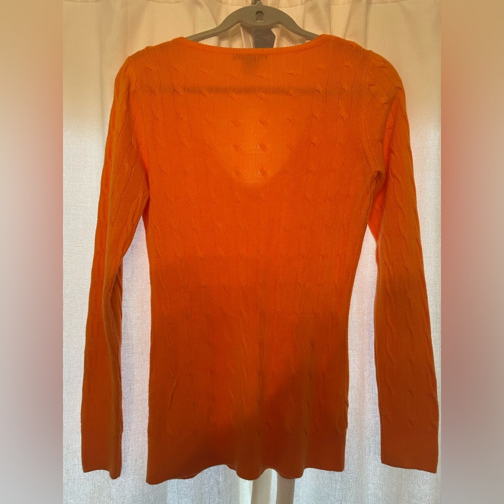 Gorgeous orange sweater. If this is your team color, show your support in style.
